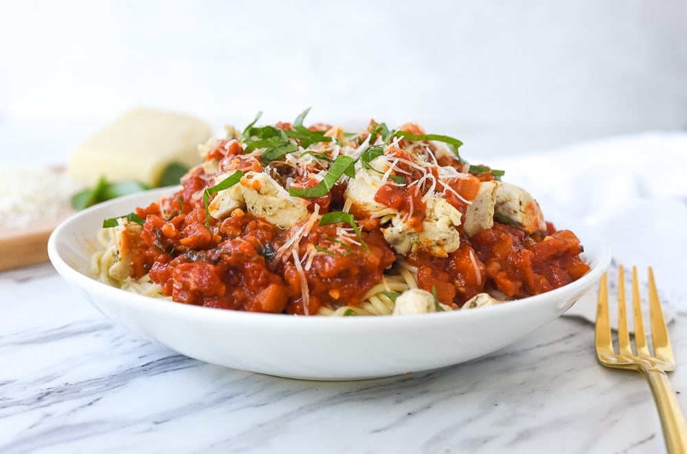 white bowl full of chicken spaghetti