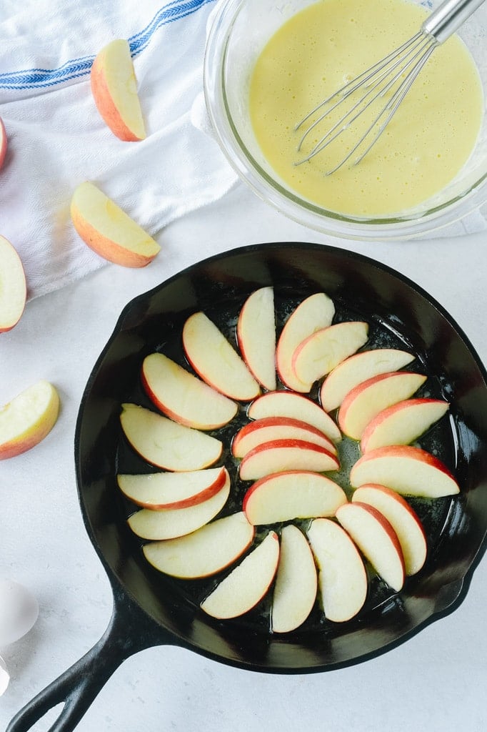 Sliced apples in a cast iron pan