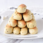 stack of olive garden bread sticks on a plate