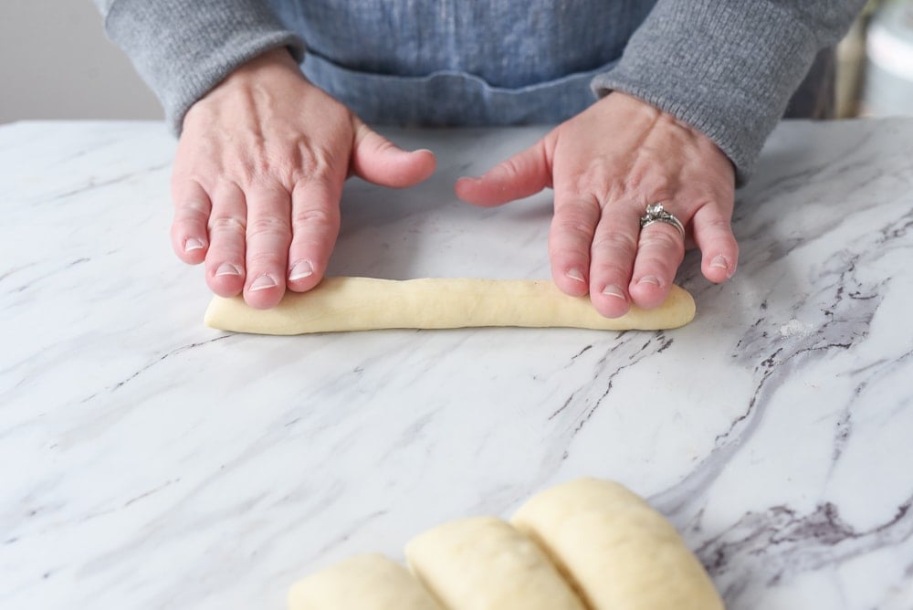 rolling out copycat olive garden bread sticks