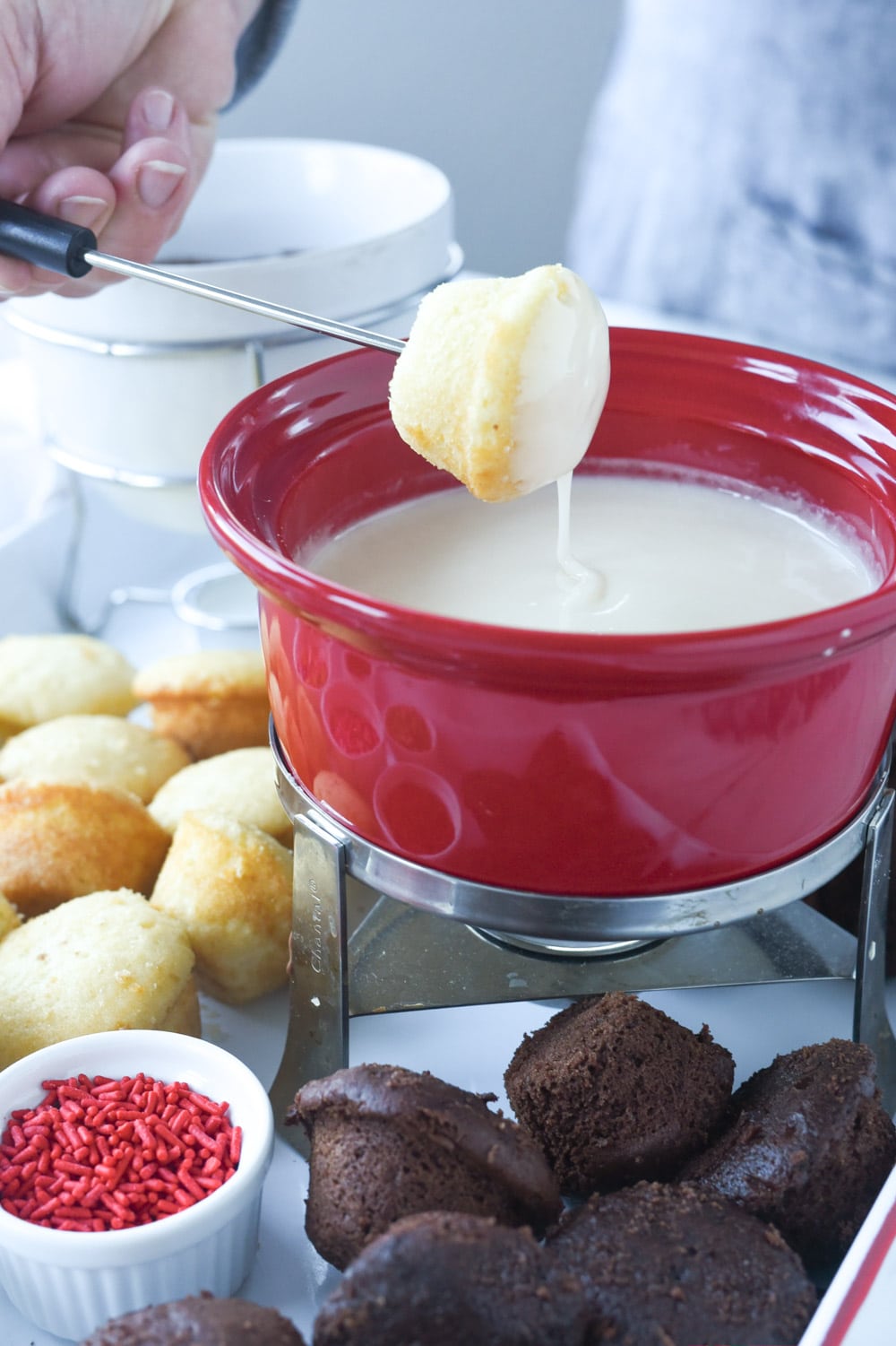 dipping cupcake into chocolate fondue