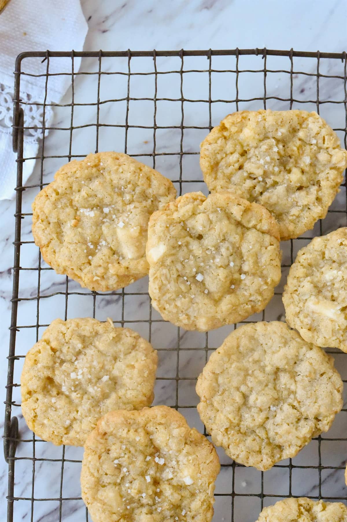 salted white chocolate chip cookies on a cooling rack