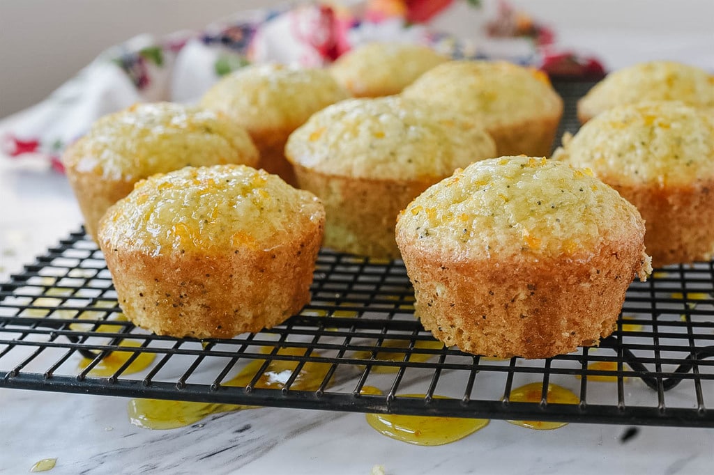 almond poppy seed muffins on cooling rack