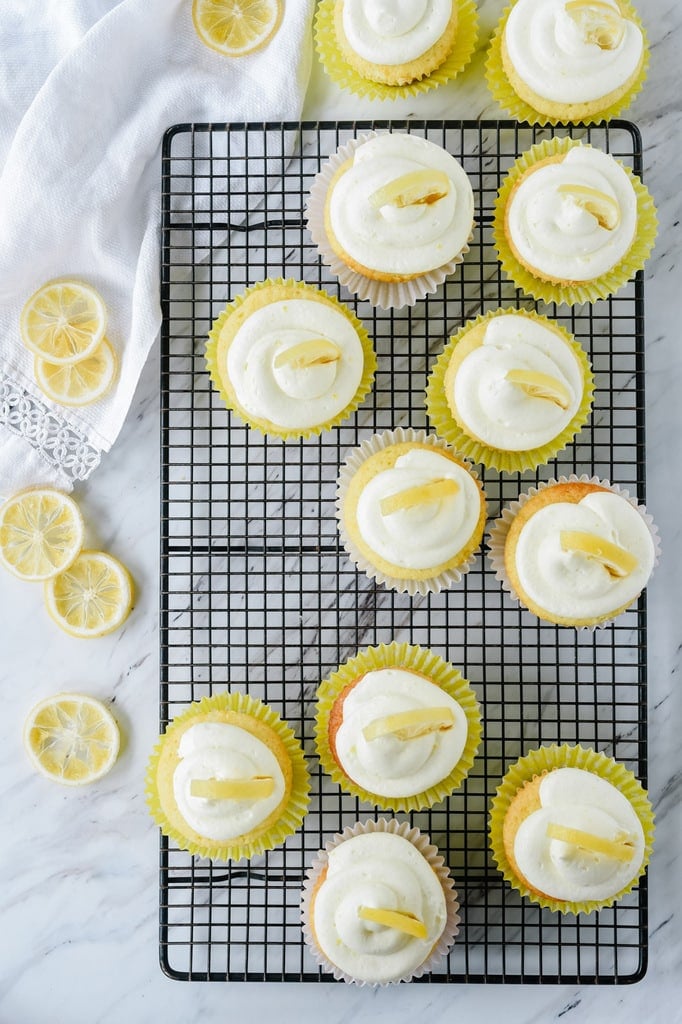 lemon curd cupcakes on a cooling rack