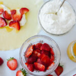 bowls of strawberries and cream for crepes