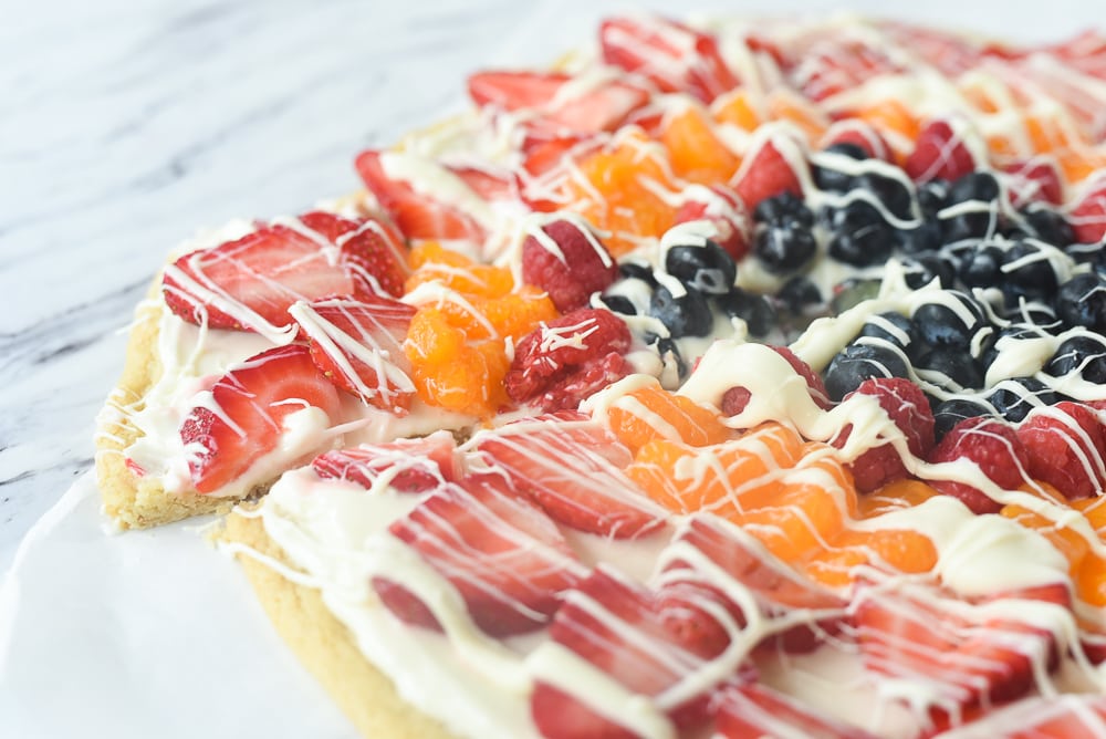 side view of a slice of fruit pizza