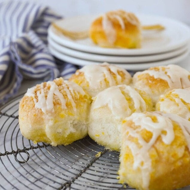 orange rolls on a cooling rack