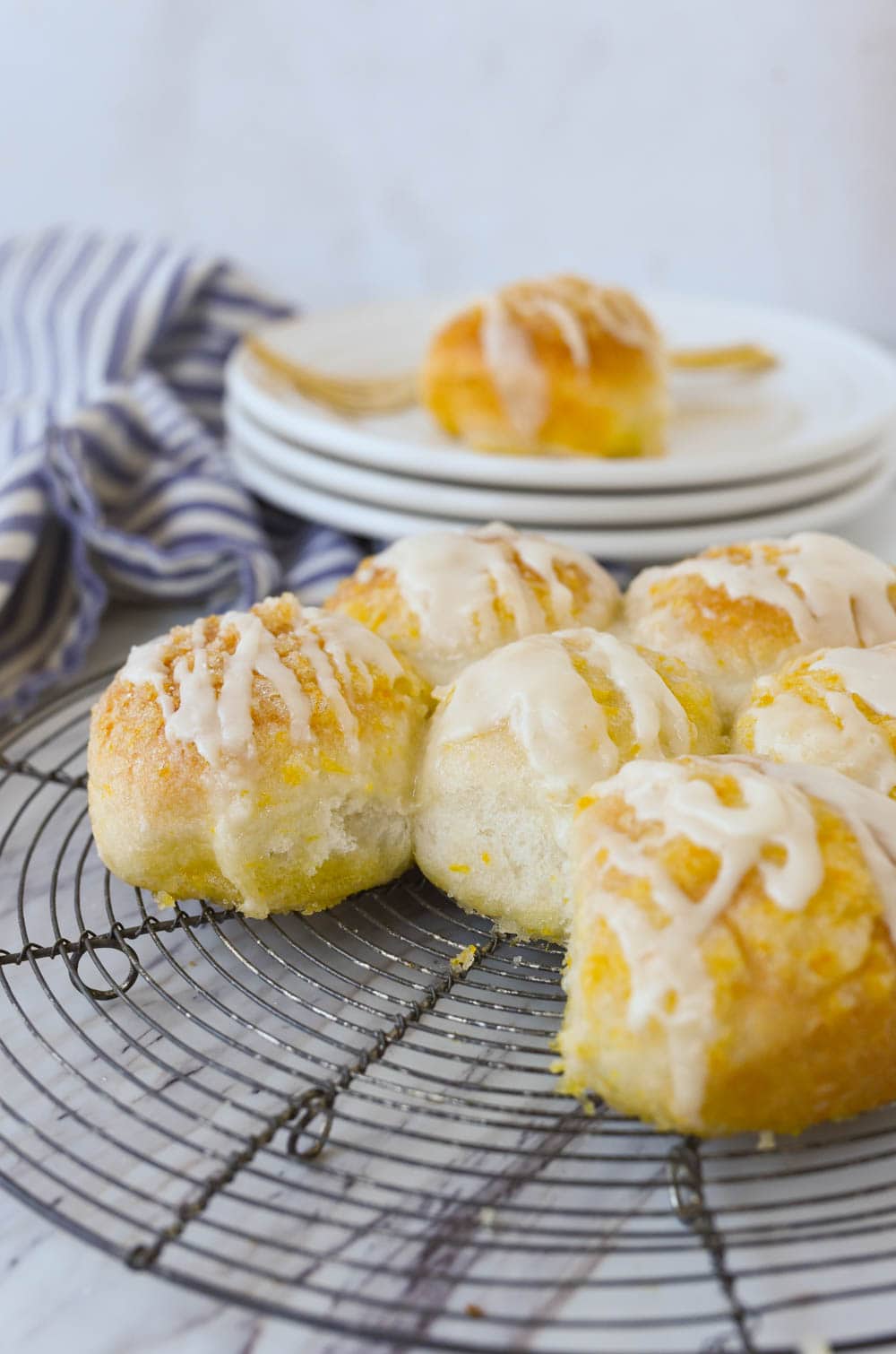 orange rolls on a cooling rack