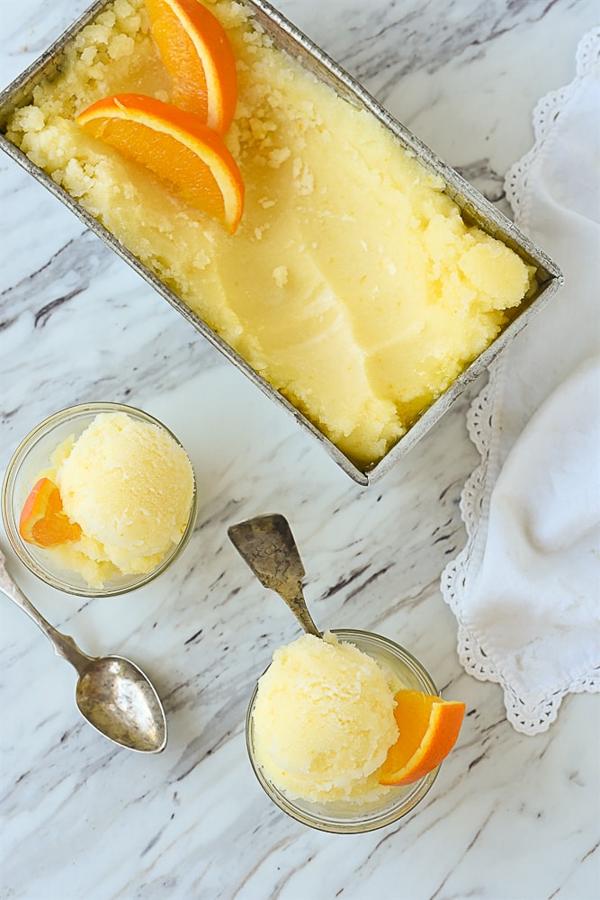 overhead shot of orange ice in bowls