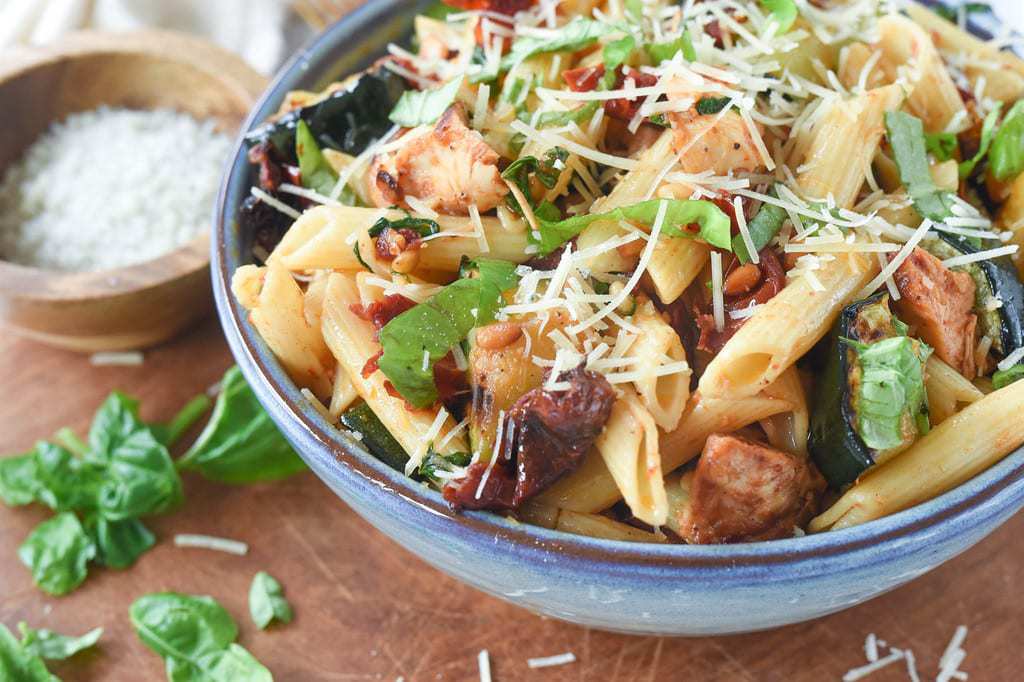 bowl of garlic chicken pasta with roasted tomatoes