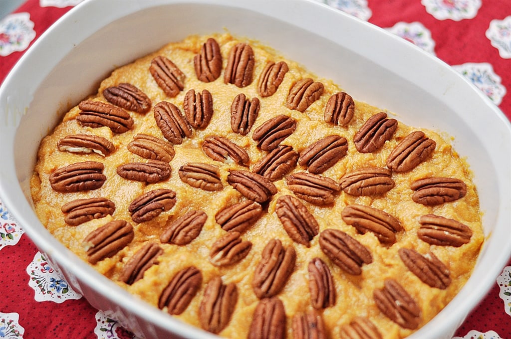 Pecan Topped Sweet Potatoes in a casserole dish