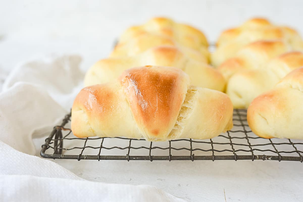 homemade rolls on a baking rack