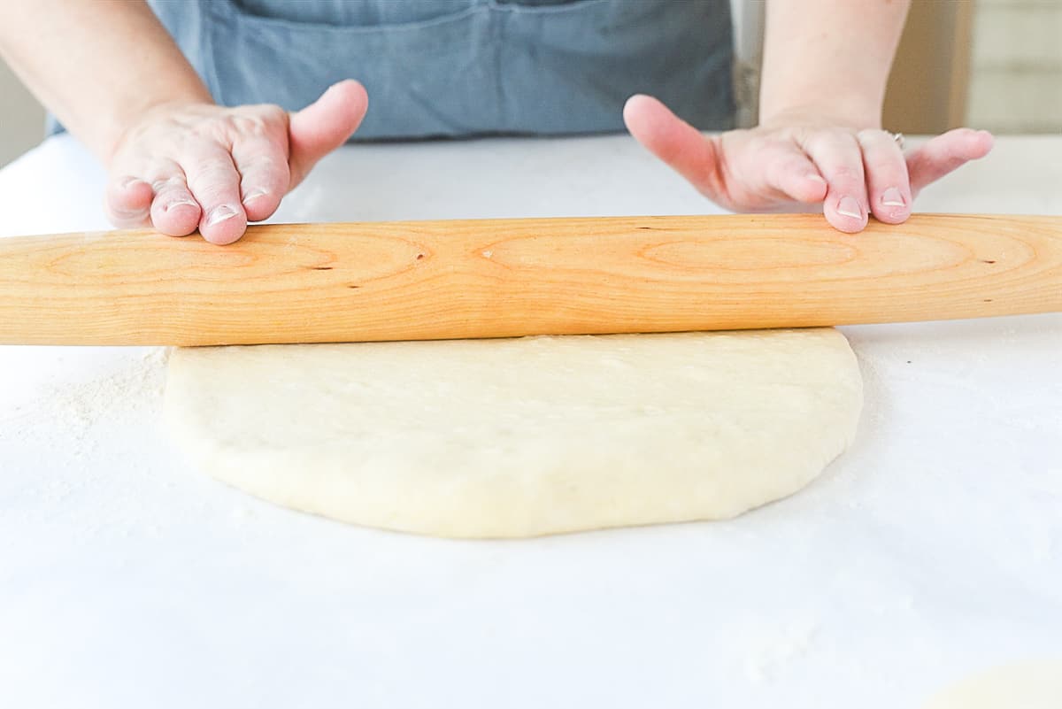 rolling dough out with rolling pin