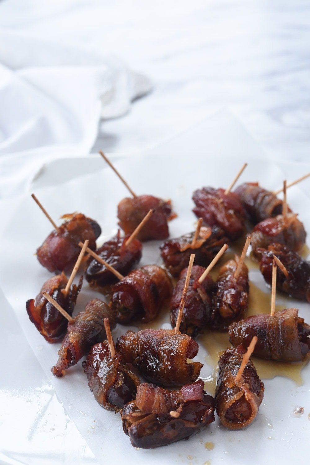 bacon wrapped dates with tooth picks