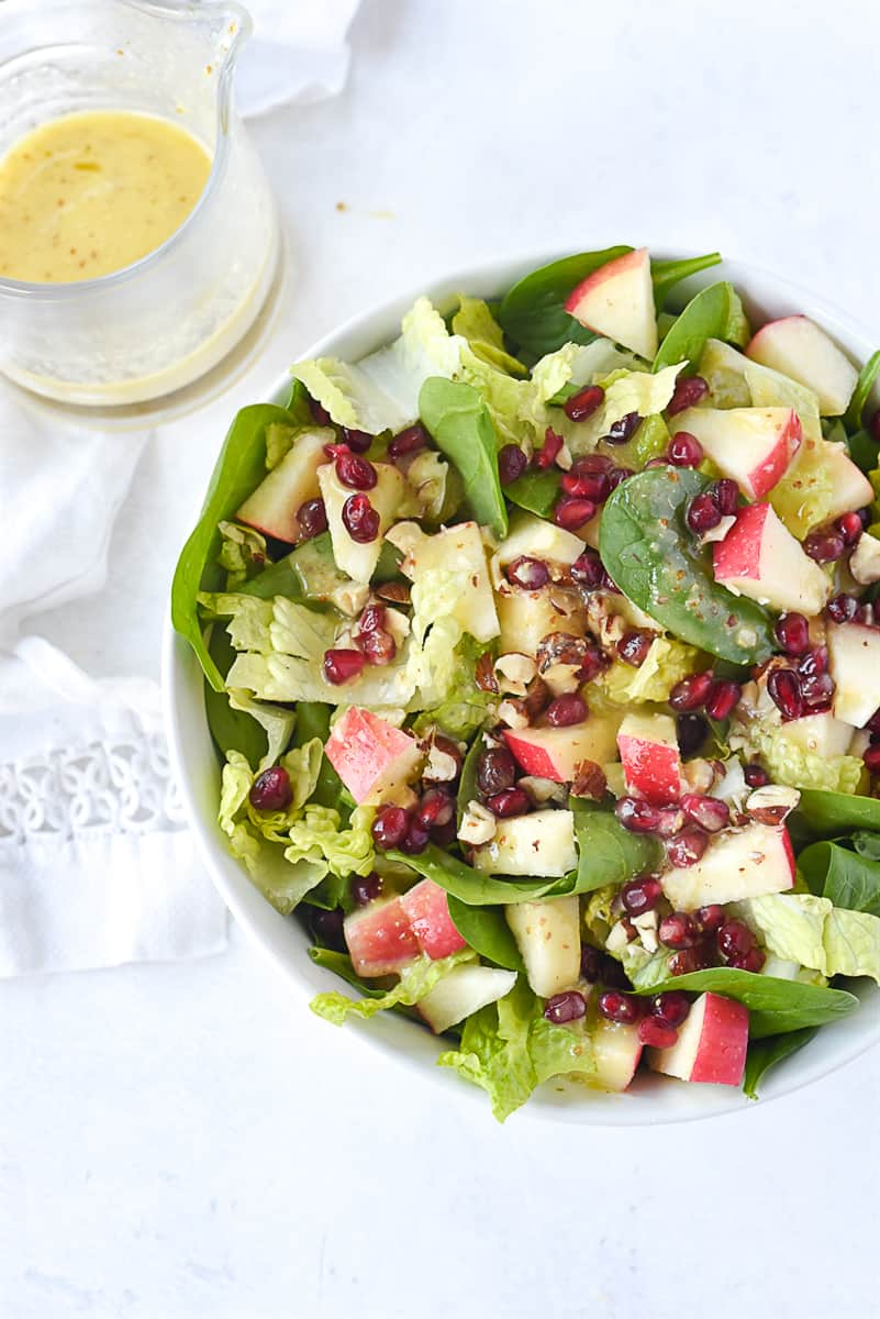 overhead shot of lemon dijon dressing on salad