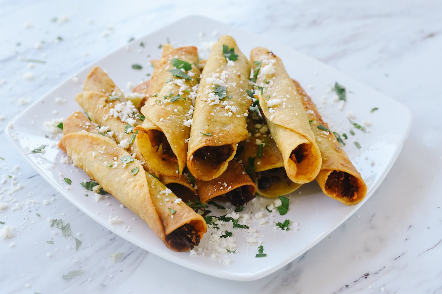 taquitos with cheese and cilantro