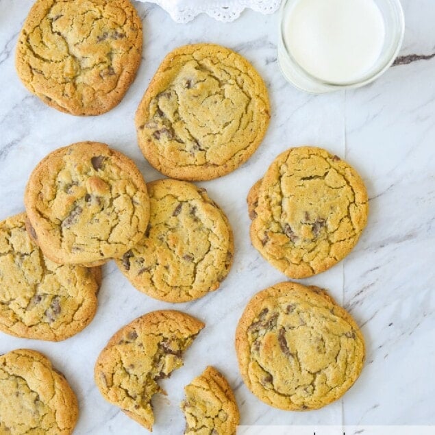 overhead shot of chocolate chip cookies and milk
