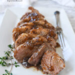 fig glazed pork tenderloin on a white plate