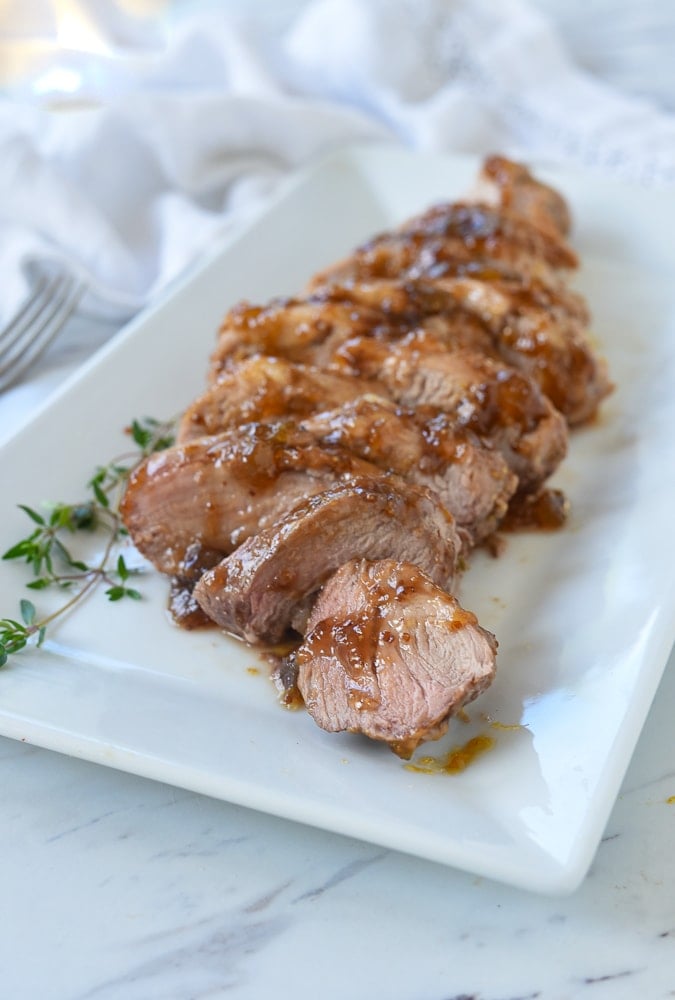 fig pork tenderloin on a white plate