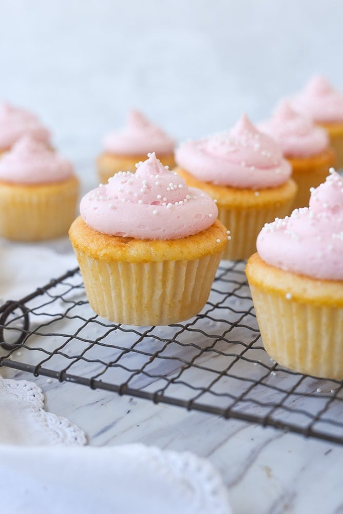 pink lemonade cupcakes with white sprinkles