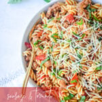 Sausage and Tomato Pasta with Parmesan cheese on top