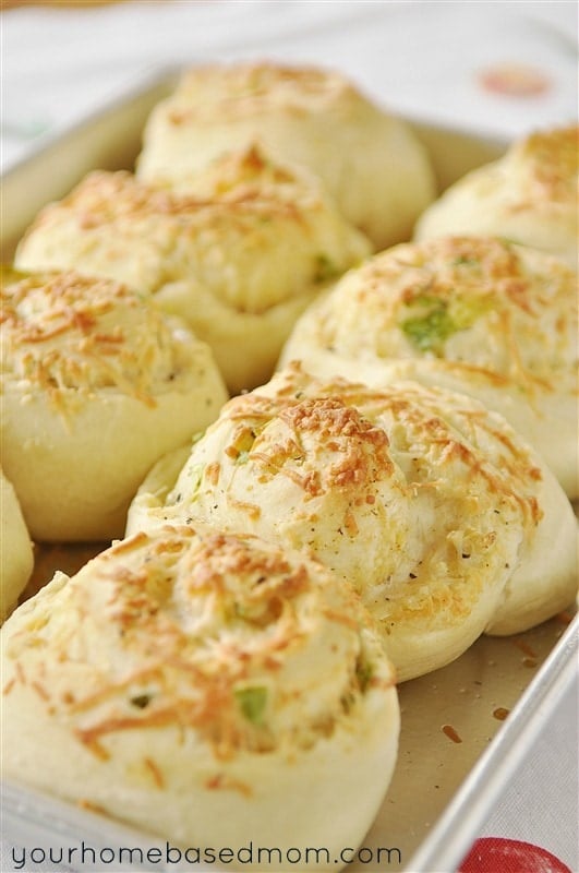 Soft and warm, these homemade rolls combine cheese, garlic and herbs for a delicious side to any meal. 