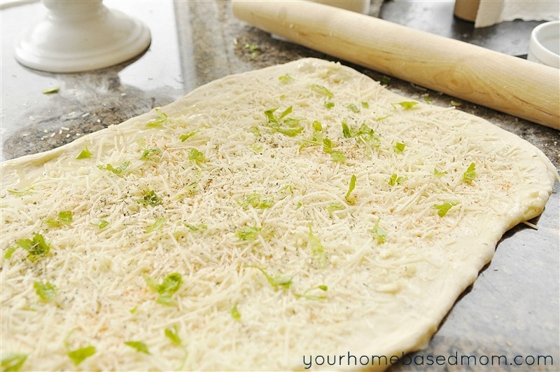 Soft and warm, these homemade rolls combine cheese, garlic and herbs for a delicious side to any meal. 