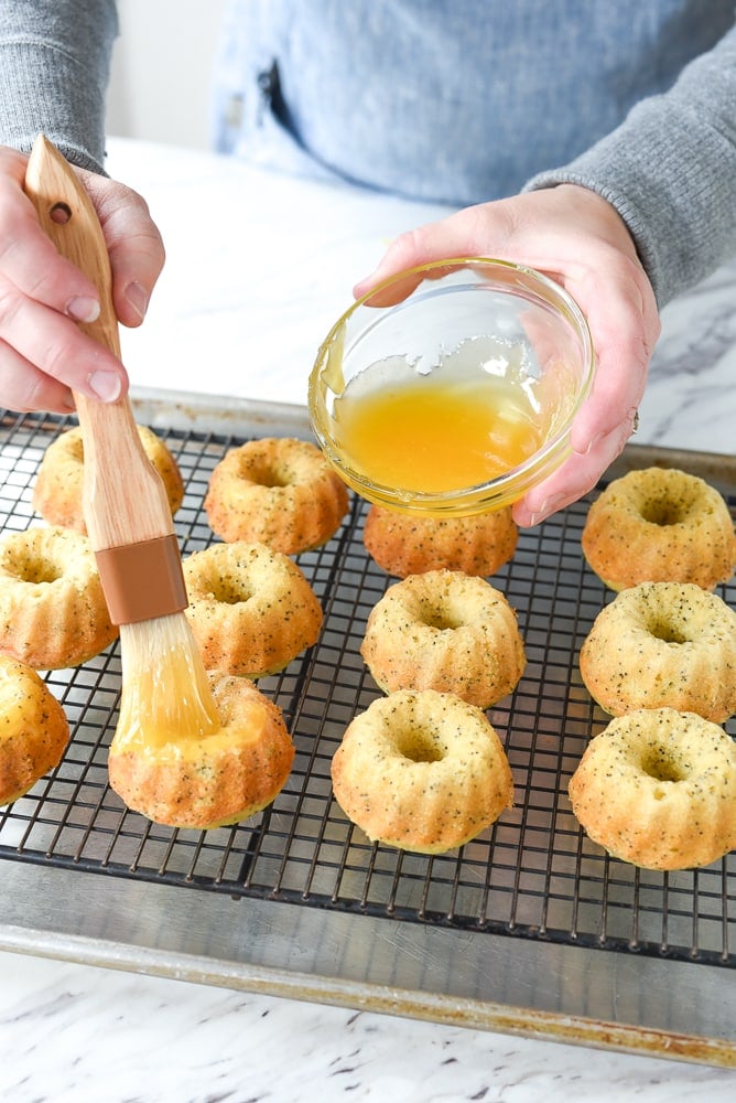 pouring glaze over bundt cakes