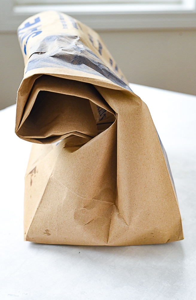 paper bag with roasted red peppers inside