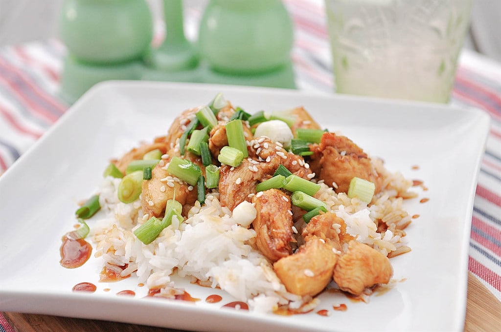 plate of sesame chicken over rice