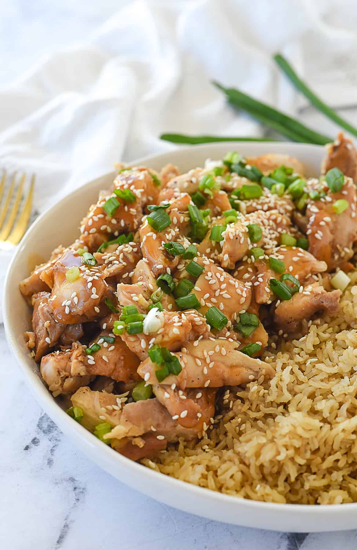 closeup of sesame chicken in a bowl