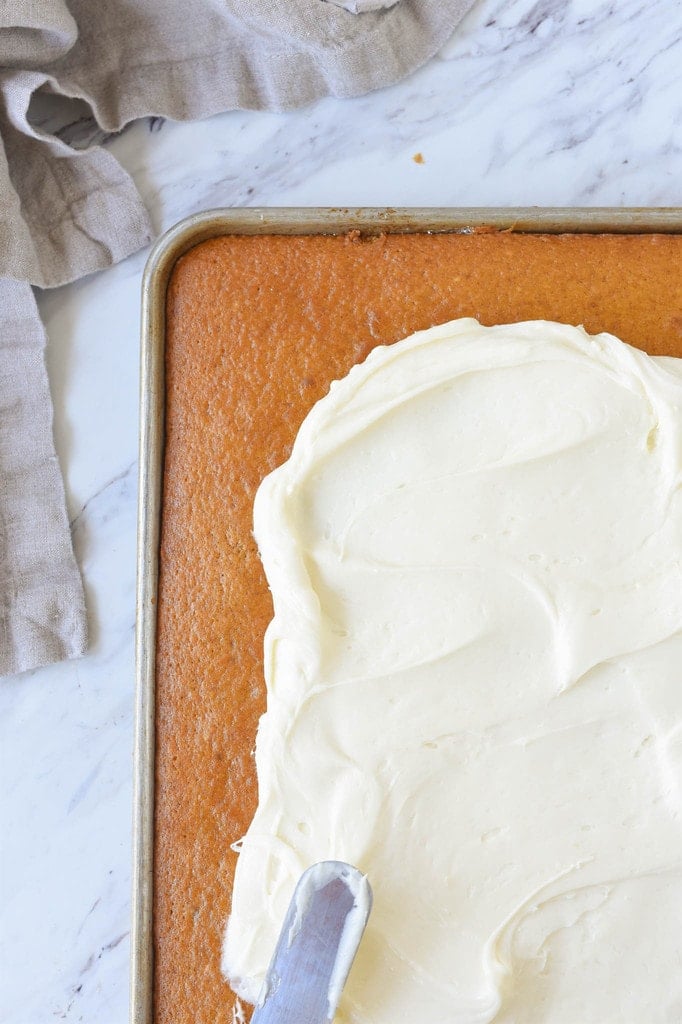 Frosting pumpkin bars with Cream Cheese Frosting