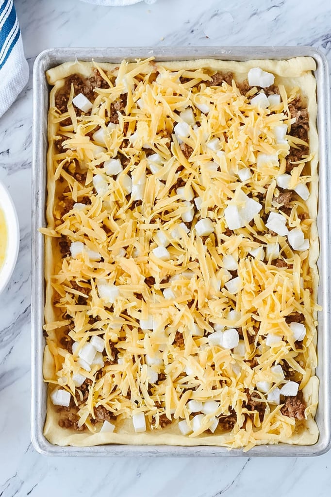 Breakfast Pizza with sausage potatoes and cheese