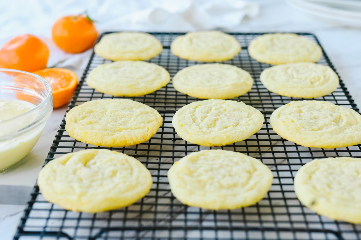 orange cookies on a cooling rack