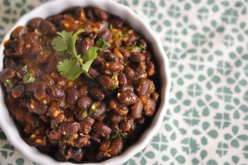 bowl of homemade Cafe Rio Black Beans garnished with cilantro