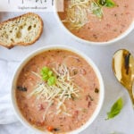 overhead shot of two bowls of tomato soup