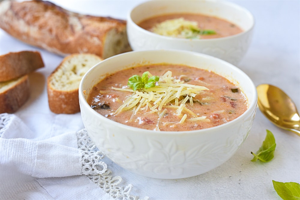 two bowls of tomato basil soup