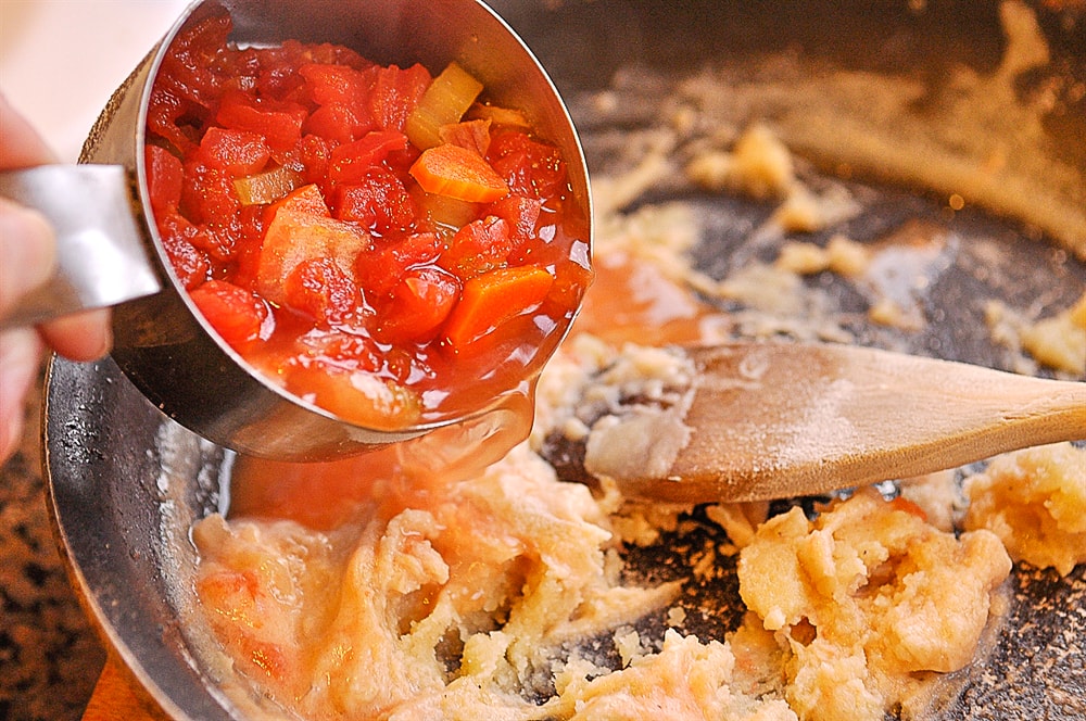 adding soup into roux