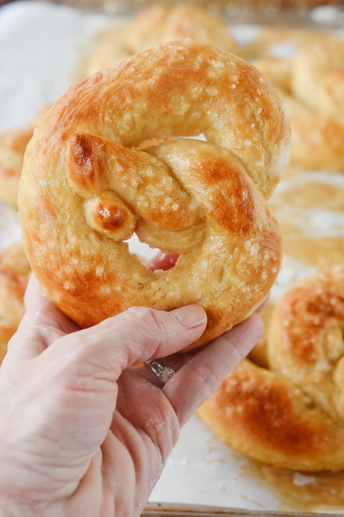 hand holding a soft pretzel