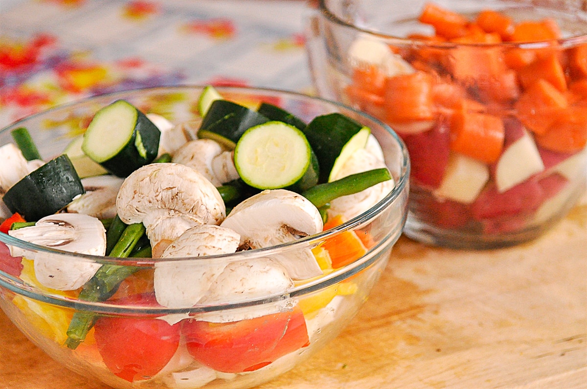 bowls of sliced vegetables