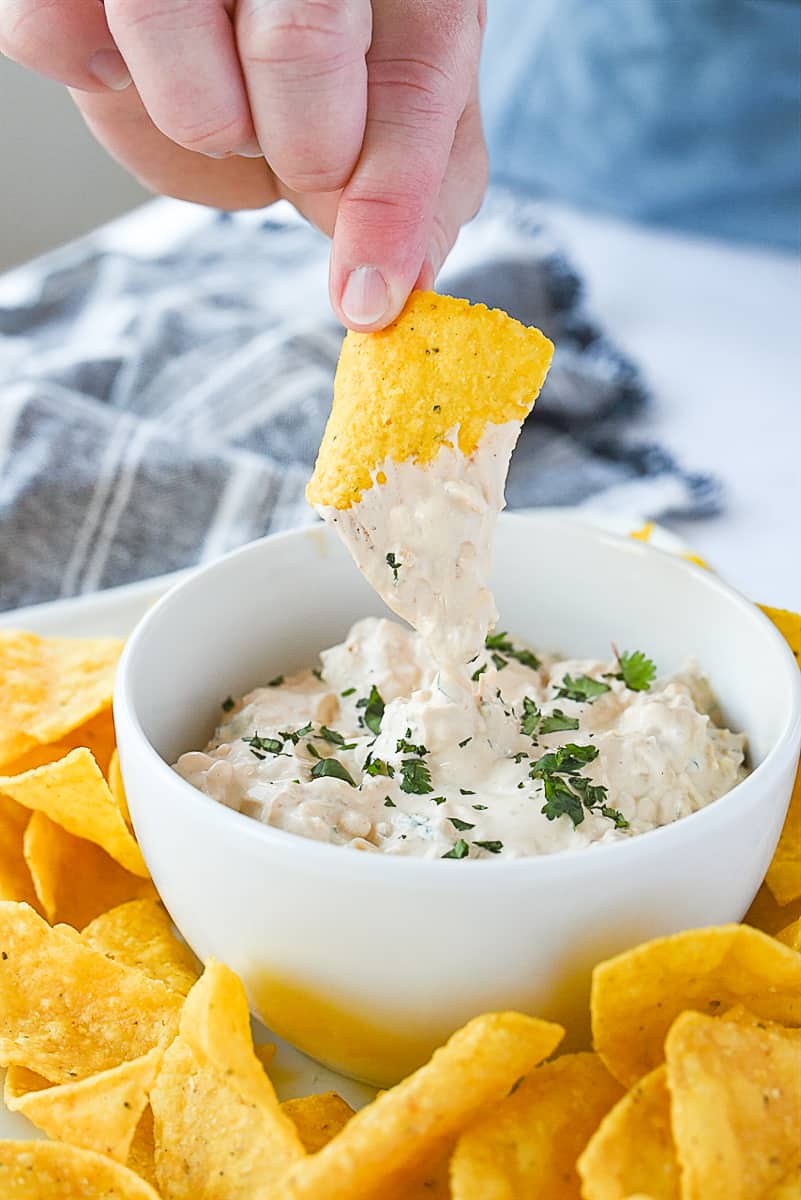 chip dipping into chipotle dip