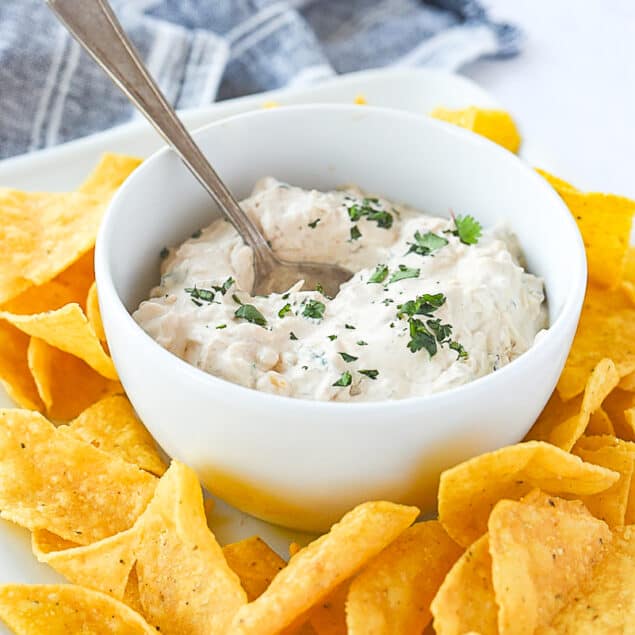 BOWL OF CHIPOTLE DIP WITH SPOON IN IT