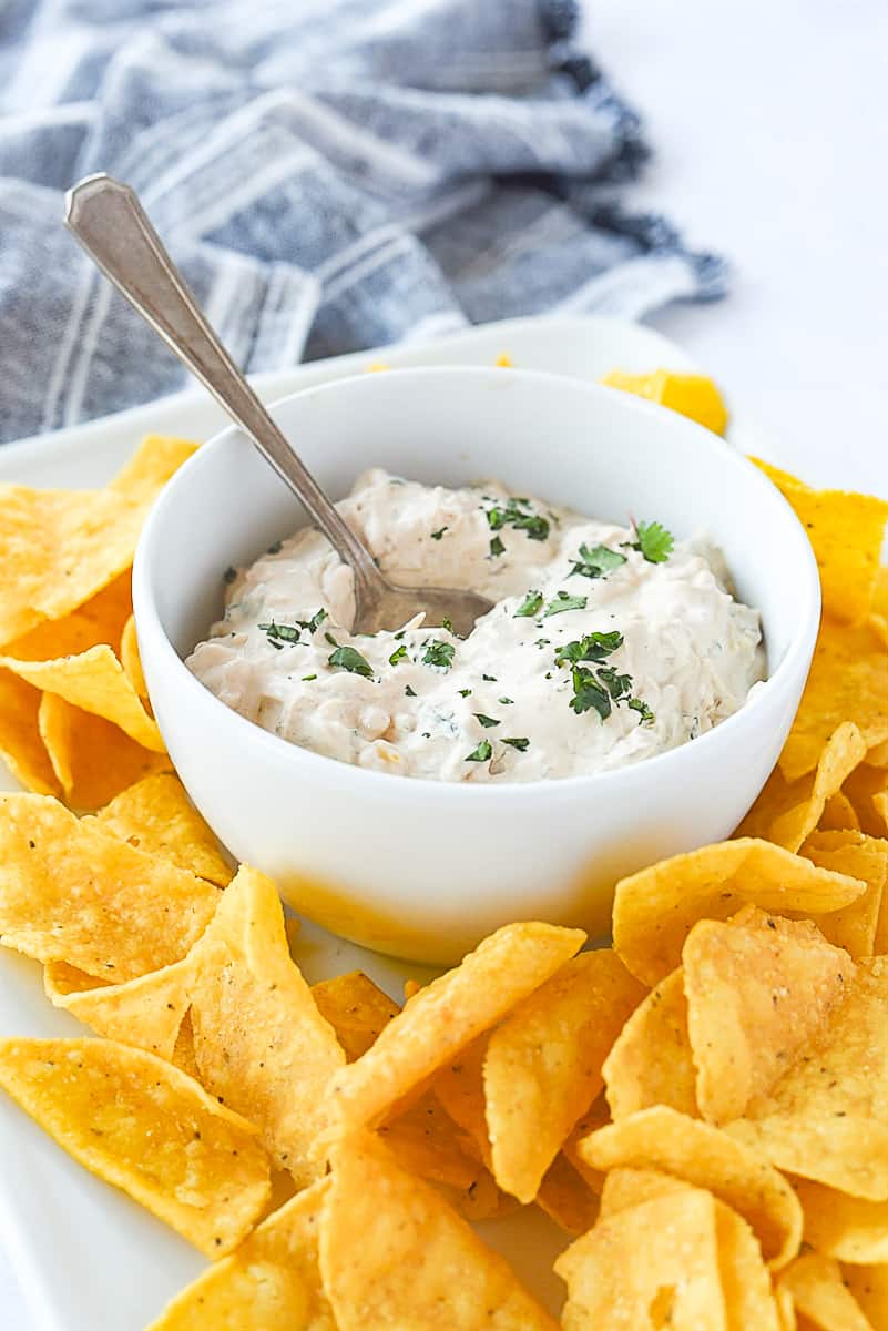 BOWL OF CHIPOTLE DIP WITH SPOON IN IT