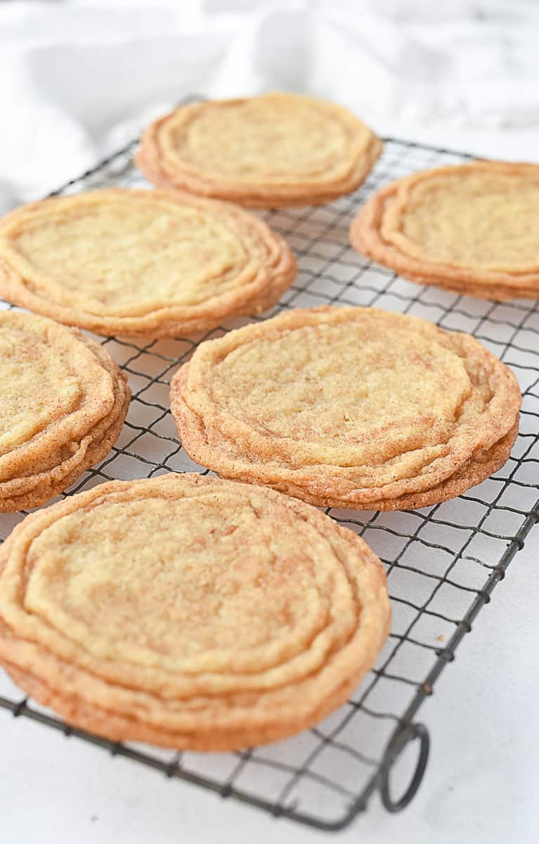 snickerdoodle cookies cooling on rack