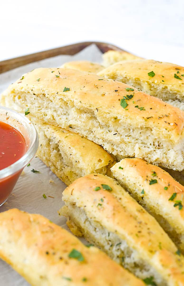 italian breadsticks on a baking sheet