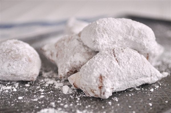 pan of powdered sugar beignets