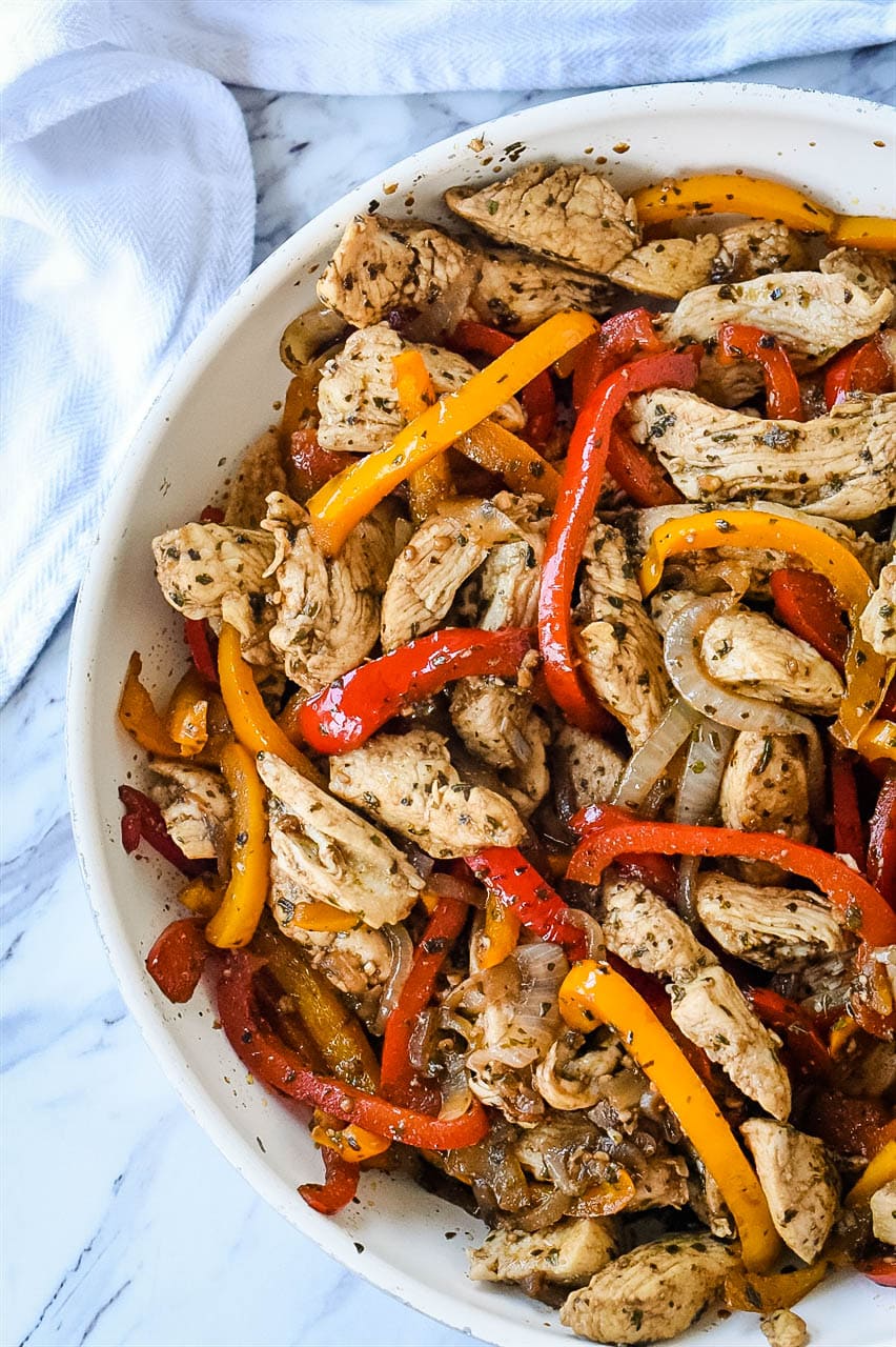 chicken and peppers in a frying pan