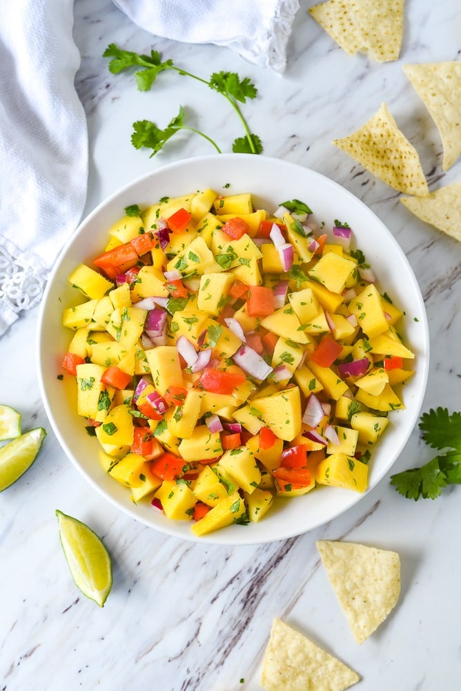 overhead shot of a bowl of mango salsa