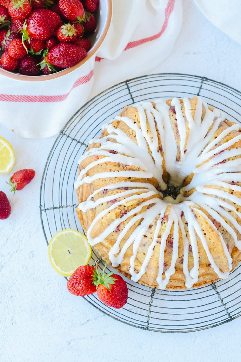 Strawberry Sour Cream Cake on a cooling rack