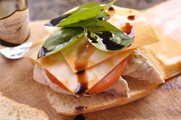 Chicken Caprese Sandwich drizzled with balsamic vinegar